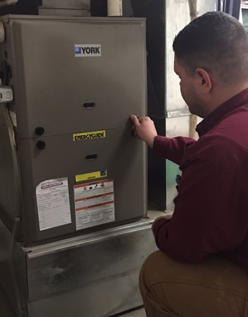 HVAC contractor installing a furnace
